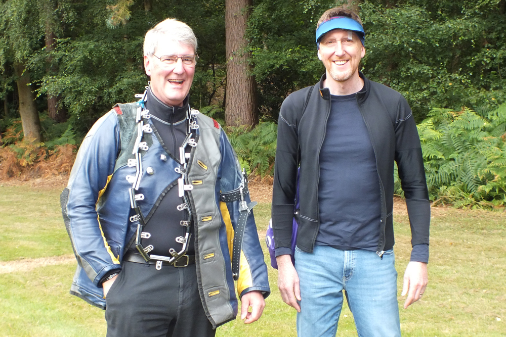 Photograph shows Simon Green (pictured right) and Neil Almond (pictured left) returning down the 50 metres range.  Neil, however, appears to be wearing a rather eye-catching piece of 'jewellery' around his neck! The fashion world seems to have gone mad! Whatever next!