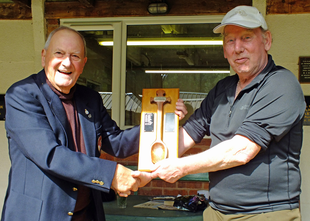 Photograph shows SSRA President - Mike B.P. Willcox (pictured left), presenting the Wooden Spoon for 2025 to Brian Parker (pictured right).