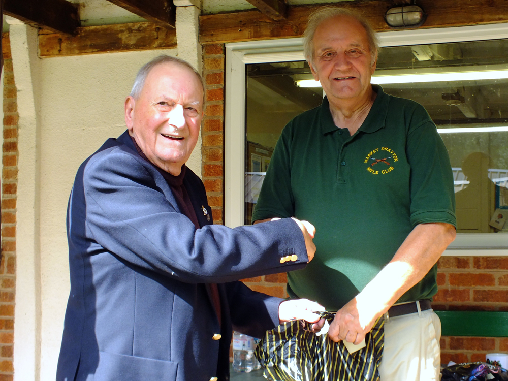 Photograph shows SSRA President - Mike B.P. Willcox (pictured left), presenting the Staffordshire Open - Class B - 1st Place Prize for 2025 to Bob Heath (pictured right).  Bob Heath received the award on behalf of Steve Rowe.