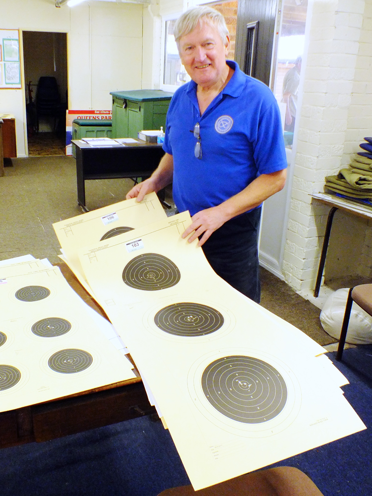 Photograph shows SSRA Secretary - Alan Boyles - beavering away in the clubhouse, gathering in the shot targets ready for their assessments.