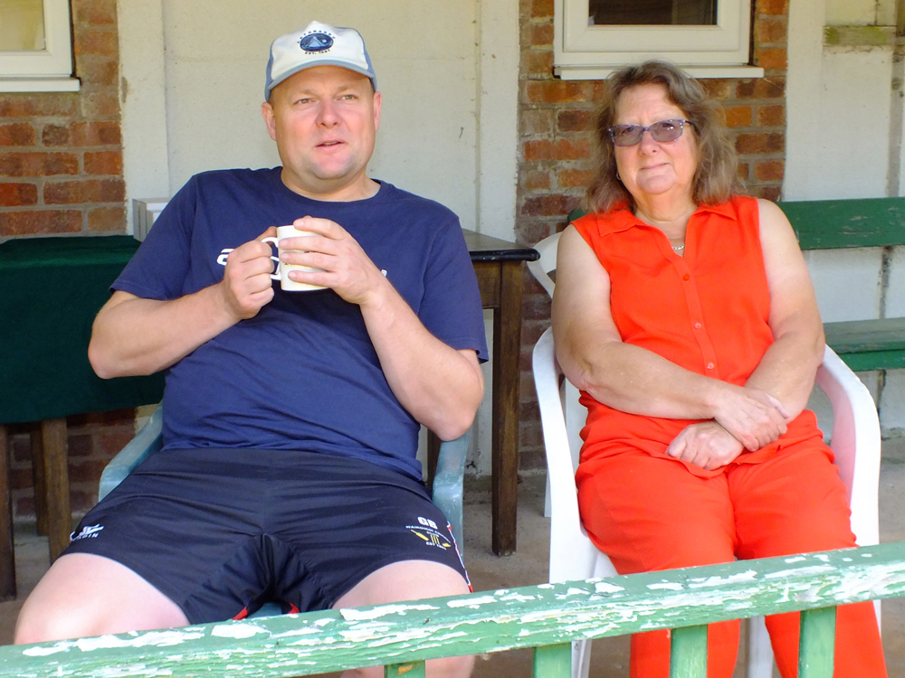 Photograph shows that the veranda is always a popular vantage point from which to view proceedings, as this couple enjoy the goings-on.
