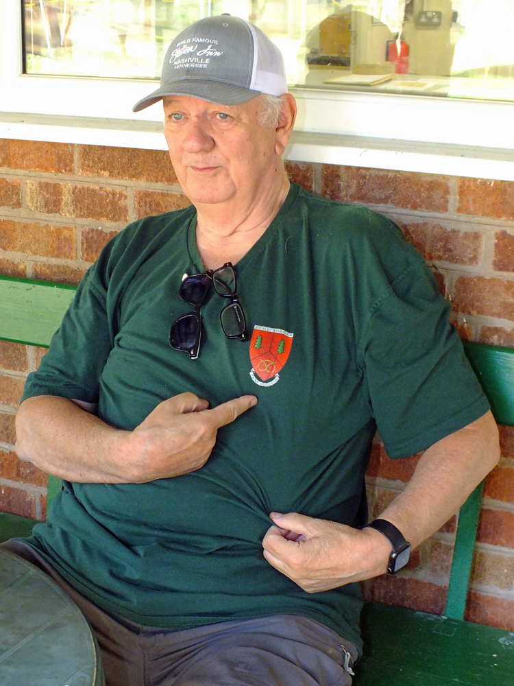 Photograph shows Lee Featherstone chilling in the shade of the veranda.