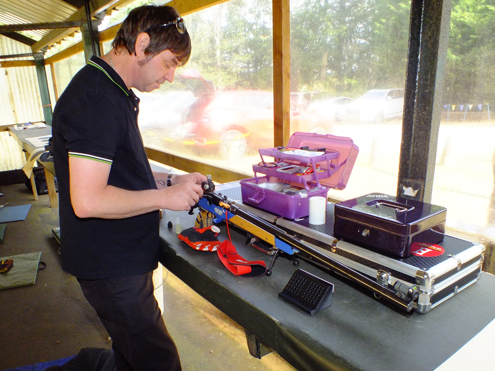 Photograph shows Nic Houghton prepping Phoebe Houghton's kit in readiness for her next detail.