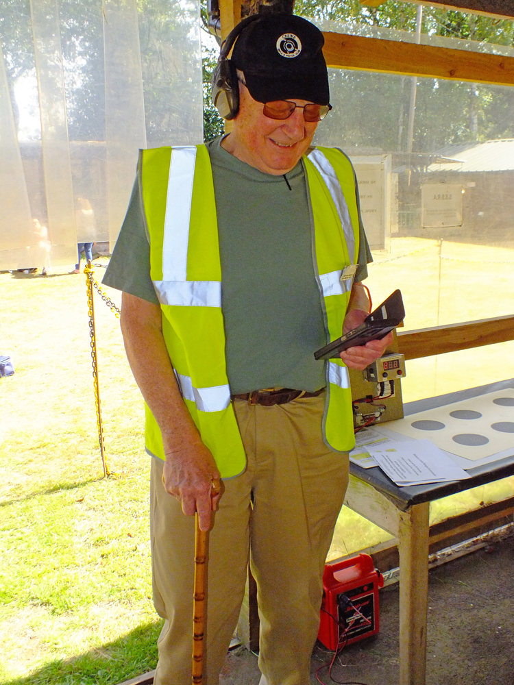 Photograph shows a valued member of the Range Officer team preparing to take control of the days action on the firing line.