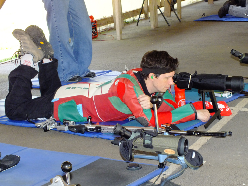 Photograph shows Richard Hemingway making final preparations on the firing line.