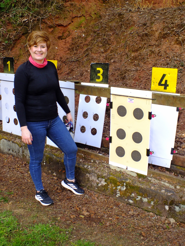 Photograph shows Amy Simcock affixing her targets to the frames prior to her detail commencing.