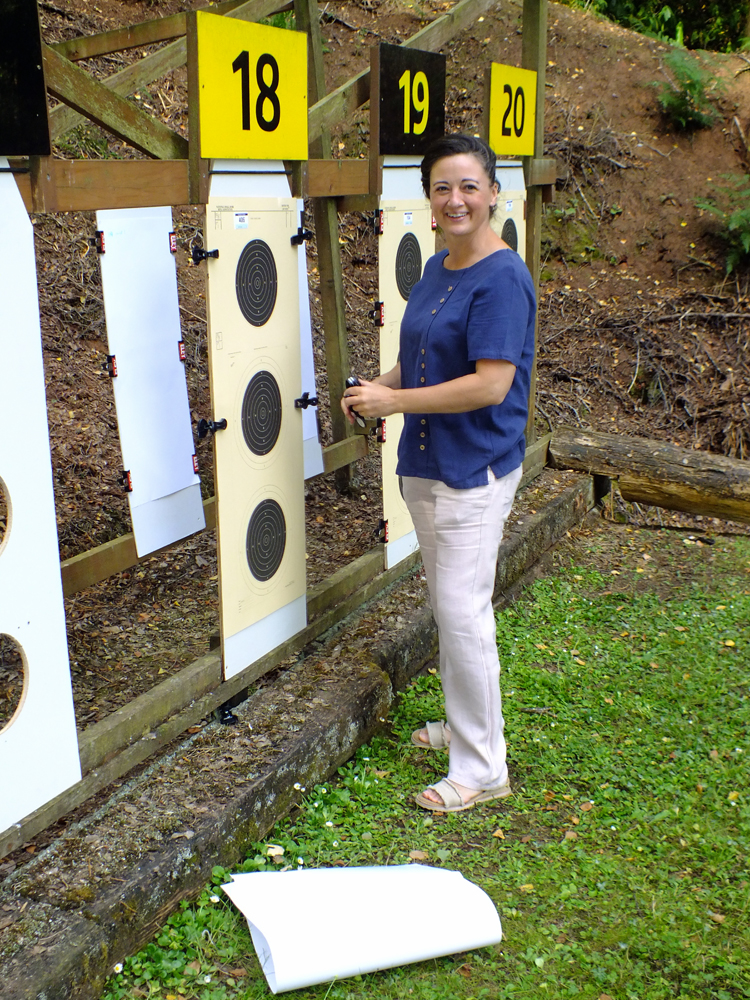 Photograph shows Natasha Minikin in the process of securing her targets before the start of her detail.