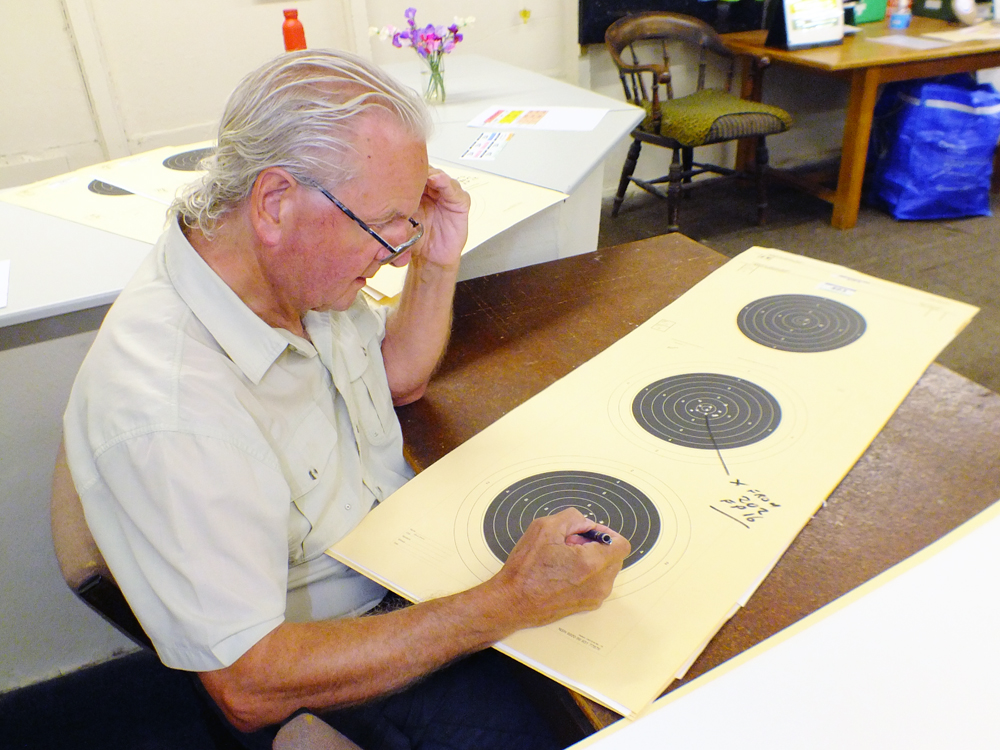 Photograph shows Tony Errington carefully checking for any cross-shots that may have strayed.