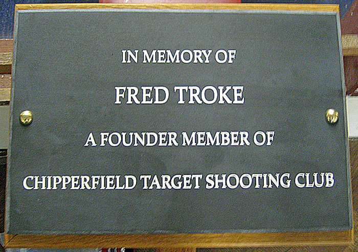 photograph shows the inscribed plaque in memory of Fred Troke, one of the founder members of Chipperfield TSC.