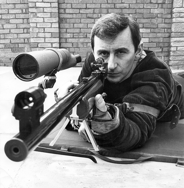 Photograph shows Fred Troke in classic prone shooting pose.
